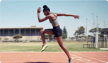 Athlete running on a running track