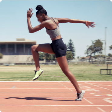 Athlete running on a running track