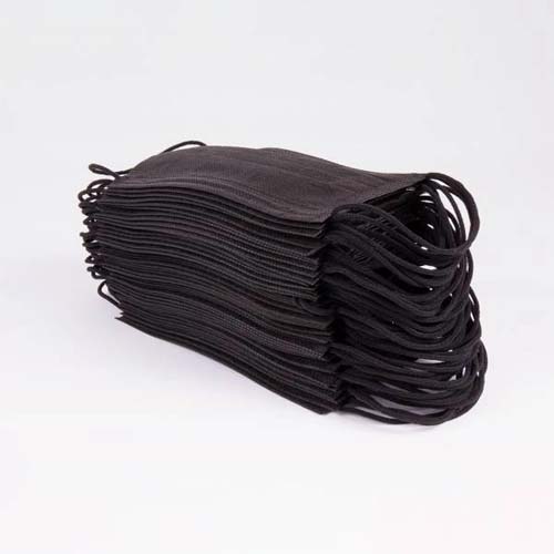 A stack of black Type IIR medical face masks neatly arranged, ready for use, against a plain white background.