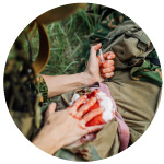 Soldier bleeding and medic treating them