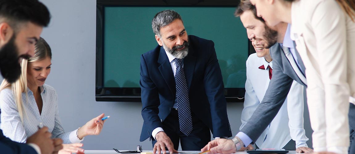 Business People Having Board Meeting In Modern Office