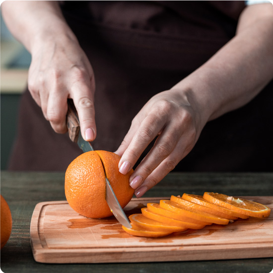Chef Cutting Oranges
