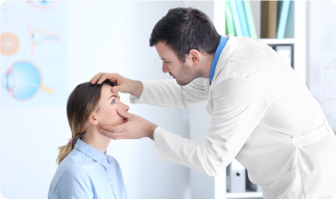 Doctor examining patients eyes