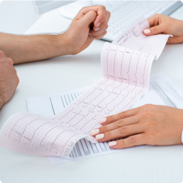 A Doctor going through ECG Test Results with a patient