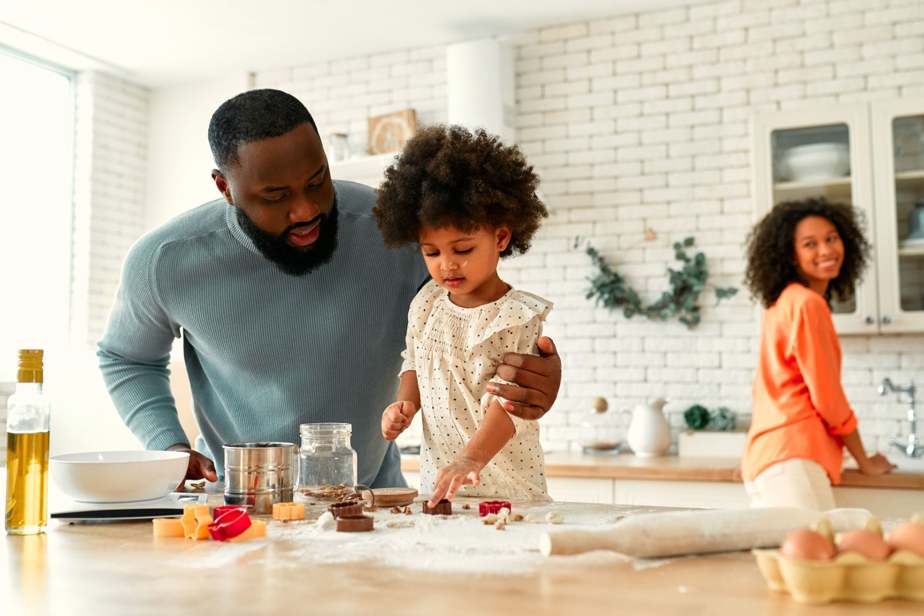 family at home around a kitchen