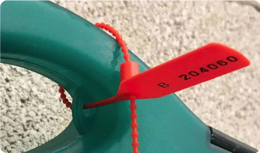 Closeup of first aid kit security seal being used on a first aid kit