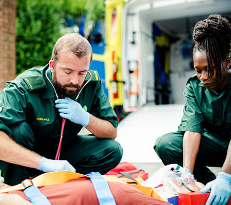 Paramedic team rescuing a critical patient Paramedic team rescuing a critical patient