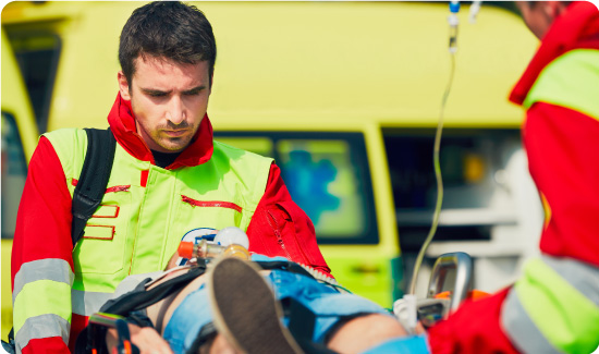 Paramedics treating patient