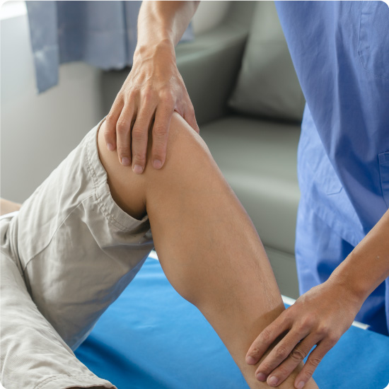 Physiotherapist checking on someones leg