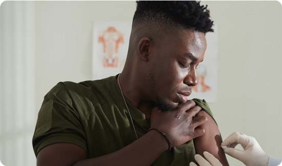 Military Person Getting Checked Up
