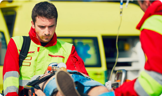 Paramedics treating patient