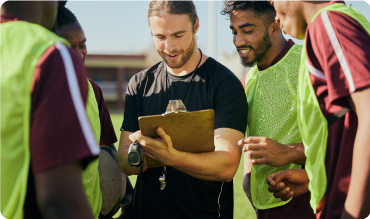 Sports coach talking to his team