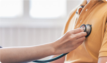 Closeup of a stehtoscope being applied to someones chest