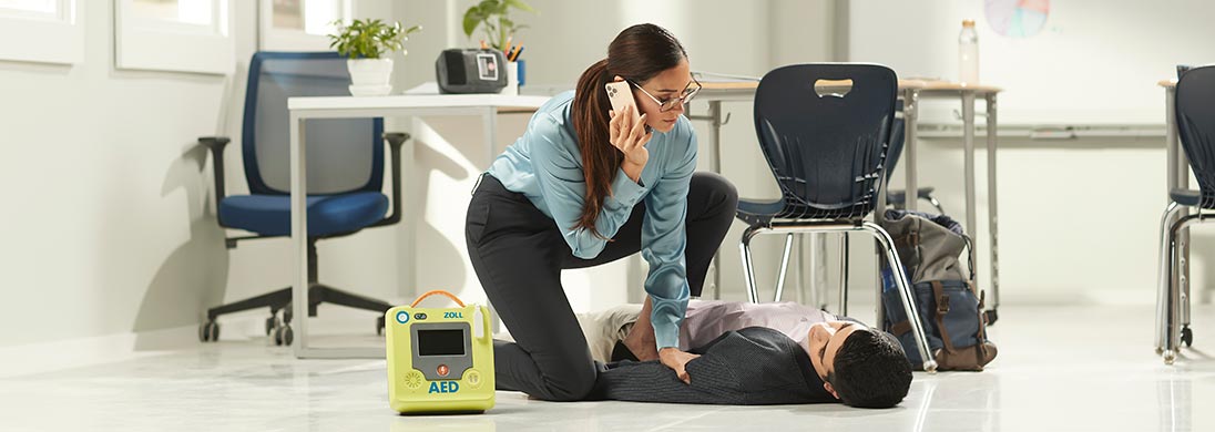 woman tending to unconcious man