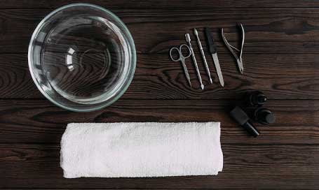 Top view of manicure tools on wooden table