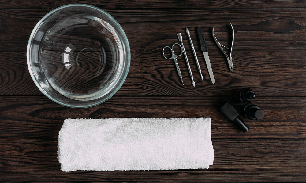 Top view of manicure tools on wooden table