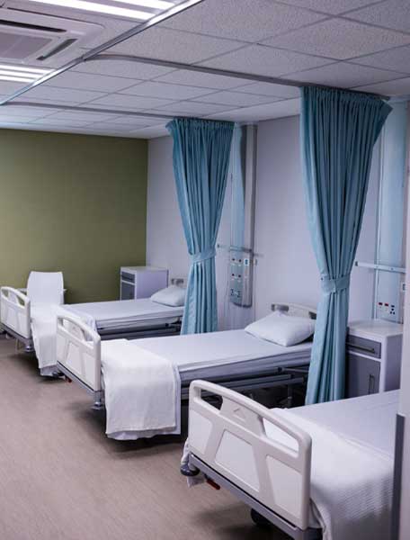 View of empty hospital beds in ward