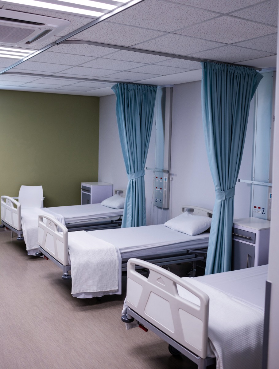View of empty hospital beds in ward
