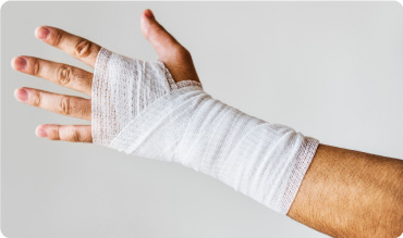 White Open Weave bandage applied to wrist