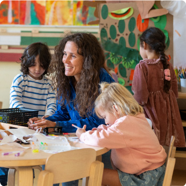 Woman with children in a nursery