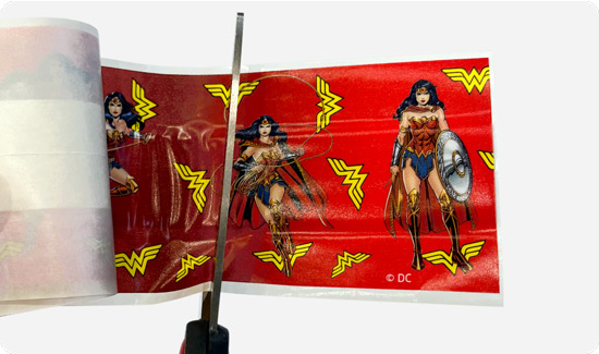 Cutting WonderWoman Plaster Strip