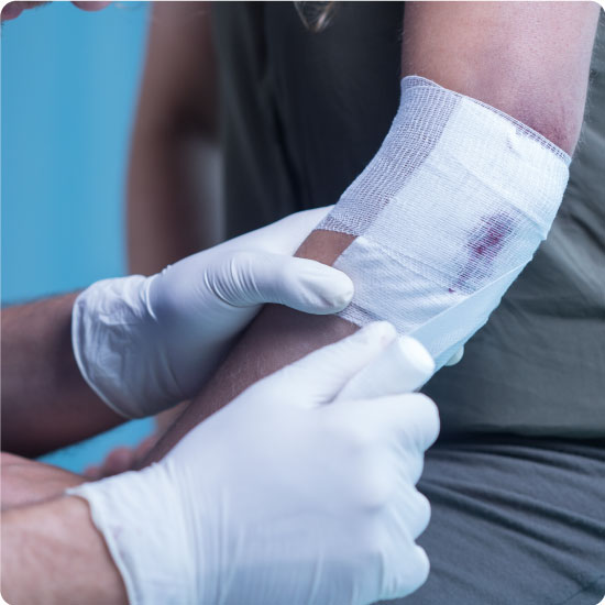 Wound dressing being applied to elbow