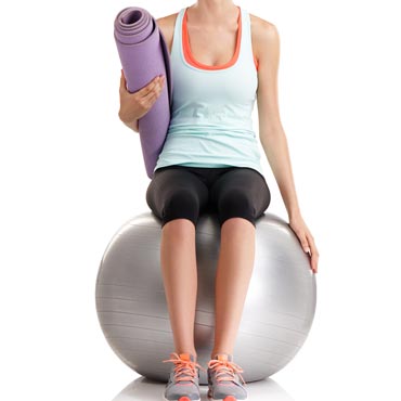 Woman using yoga ball