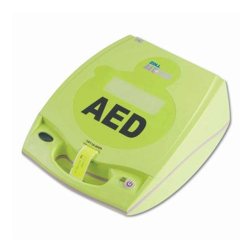 Green Zoll AED Plus defibrillator with 'AED' printed prominently on the front. The device is designed for providing automated external defibrillation in cardiac emergencies.