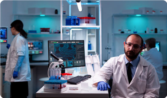 Portrait of man scientist in research laboratory looking at the camera