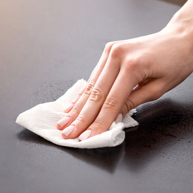 Woman wiping surface
