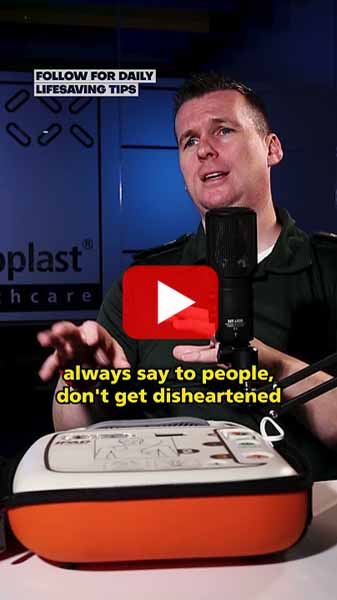 A man in a green uniform speaks into a microphone with subtitles reading, 